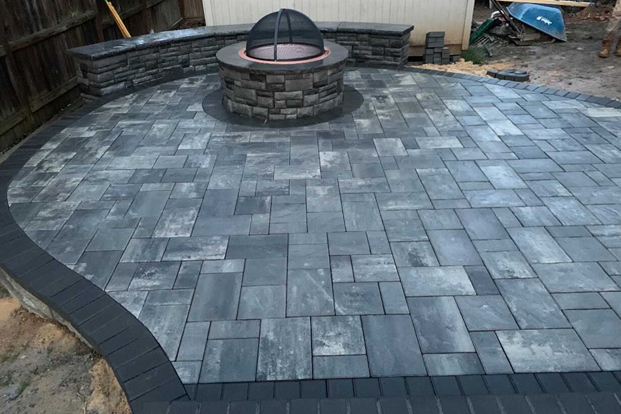 Blue and grey stone patio with firepit