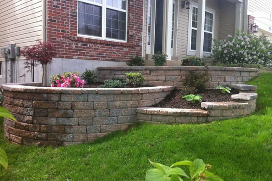Multi layered stone wall with garden beds