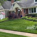 Mowing lawn of suburban home