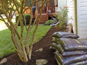 Rent-a-crew installing landscape mulch materials